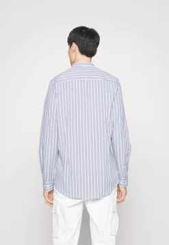 Pier One Muscle Fit Stand- Camisa - Blue -Pier One 6f902e87935b415aa0482cac3fb832df scaled